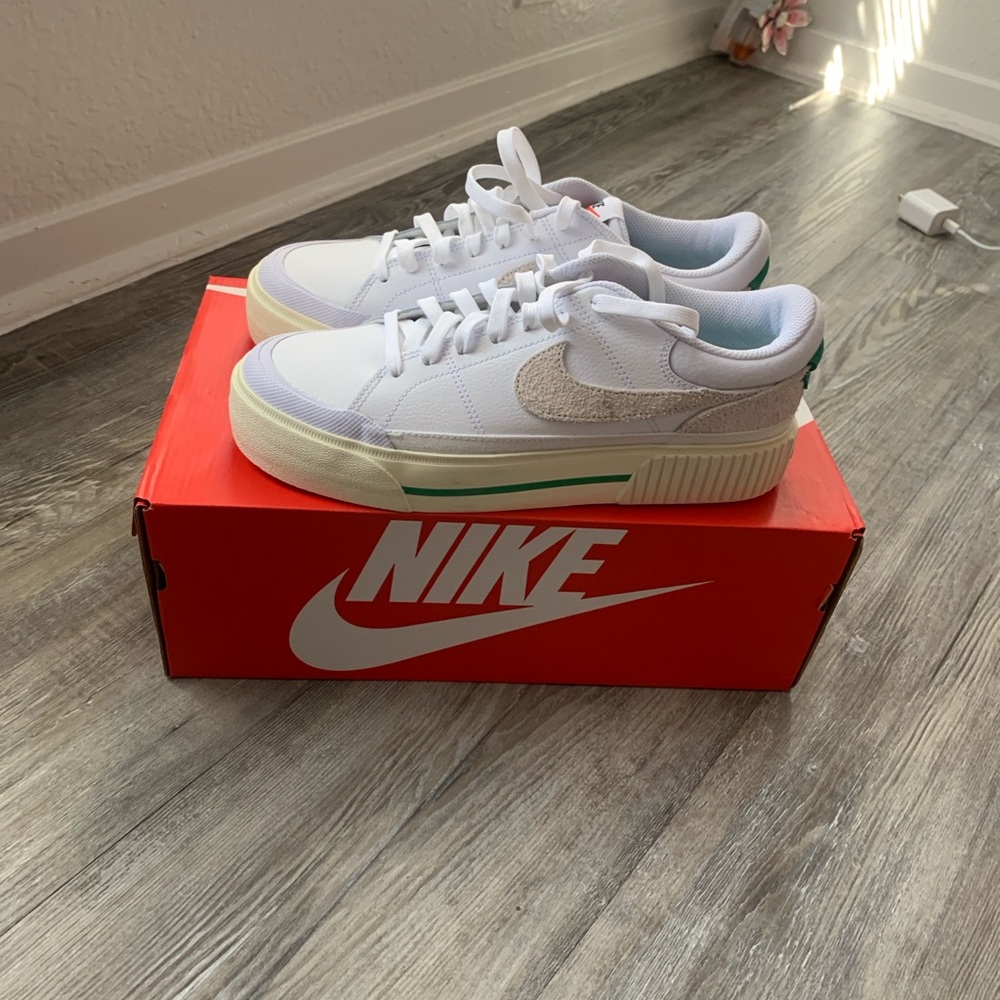 Nike White Low-Top Sneakers with Cream Swoosh and Green Midsole Stripe
